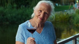 Elderly Woman With Glass Of Wine